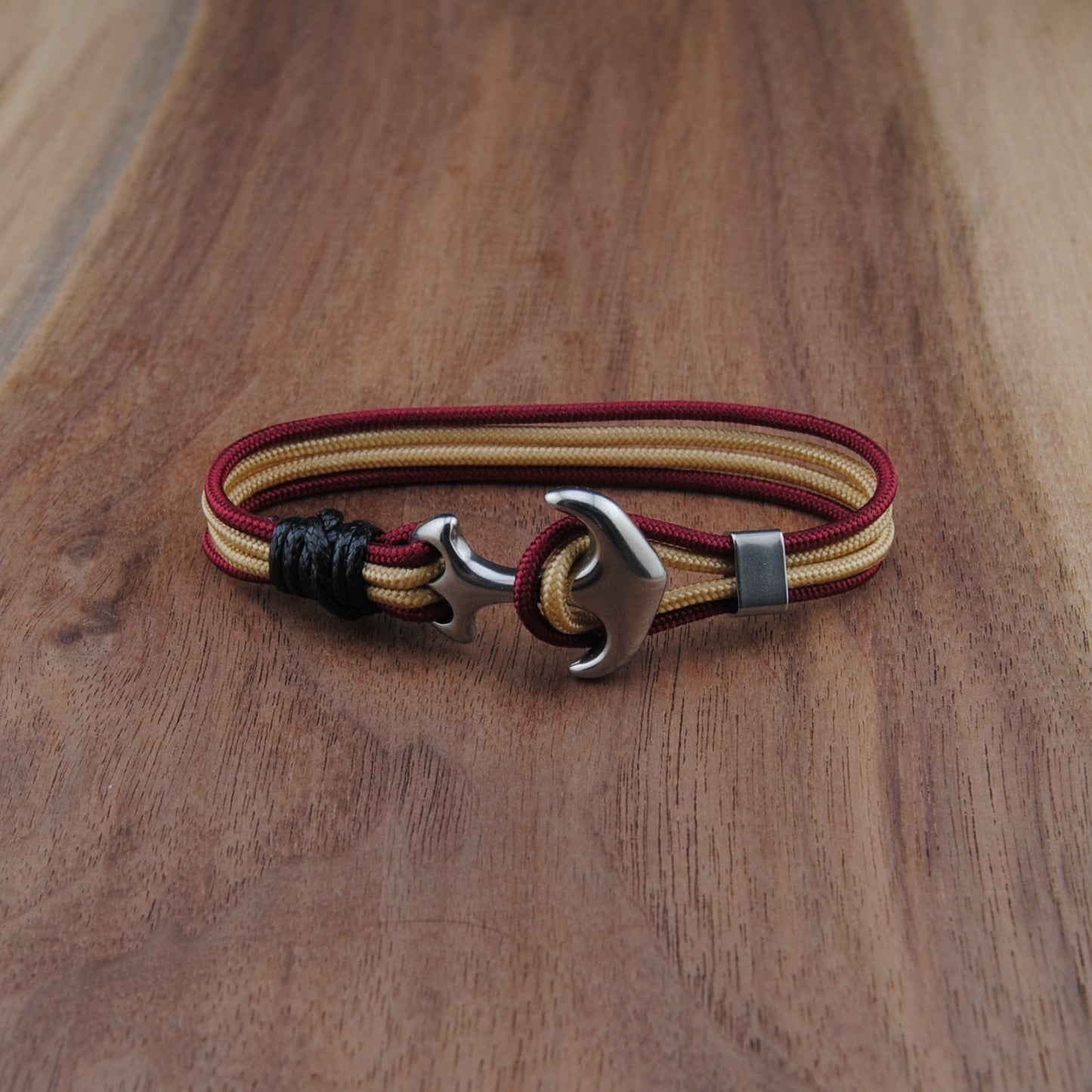 Bracelet with a unique clasp on a wooden surface