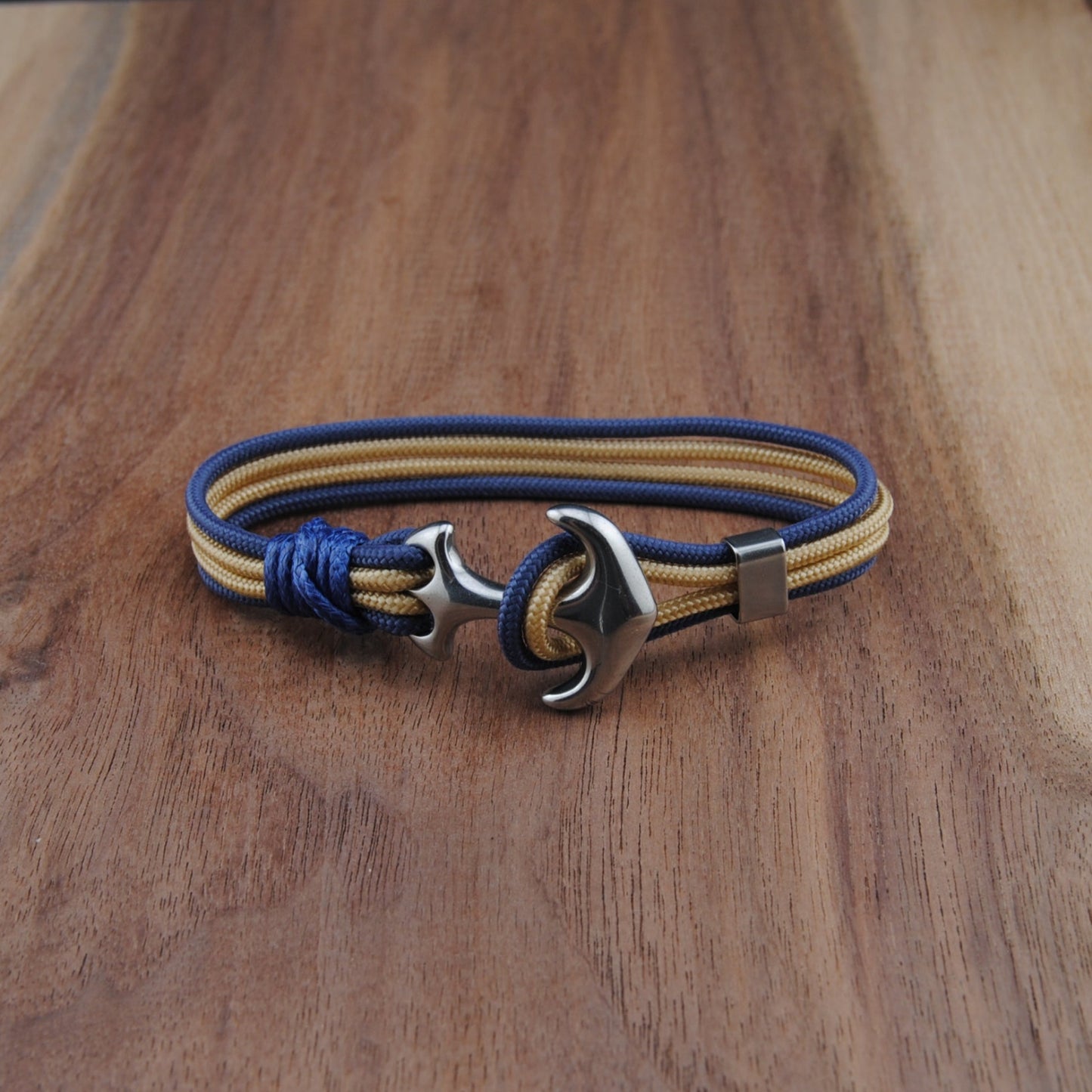 Bracelet with anchor clasp on a wooden surface