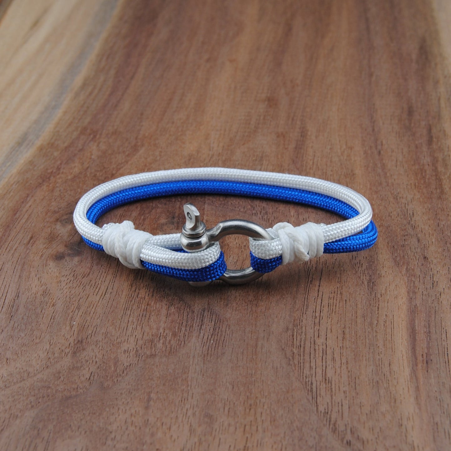 Blue and white bracelet on a wooden surface