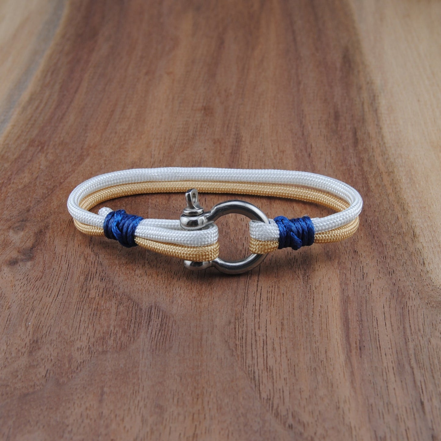 Bracelet with blue accents on a wooden surface