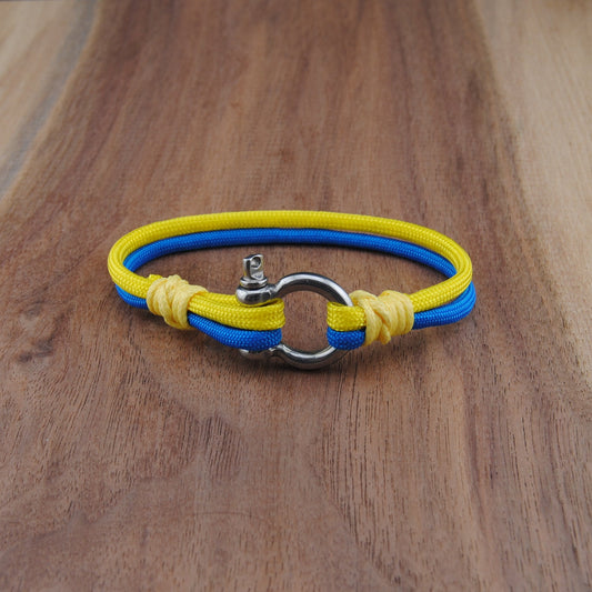 Yellow and blue bracelet on a wooden surface