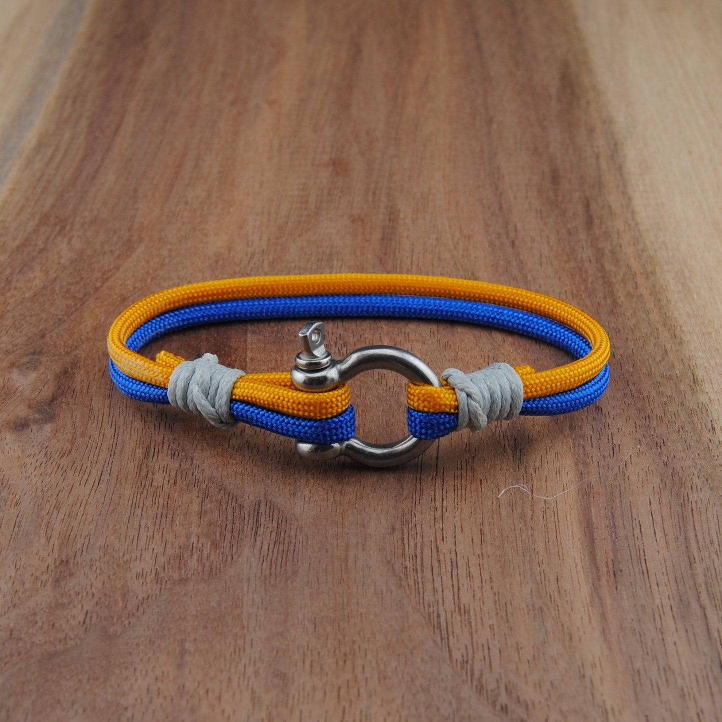 The Buffalo Hockey Pride (Buffalo Sabres) - Blue and Gold Paracord Bracelet with Stainless D-Shackle