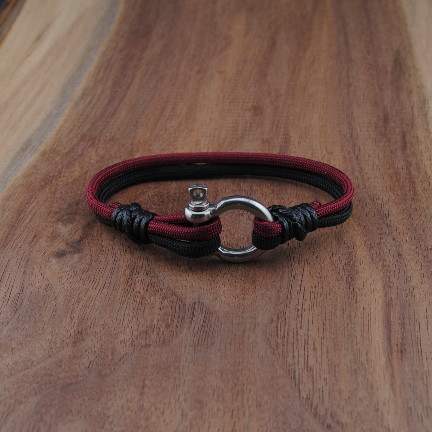 Bracelet with a clasp on a wooden surface