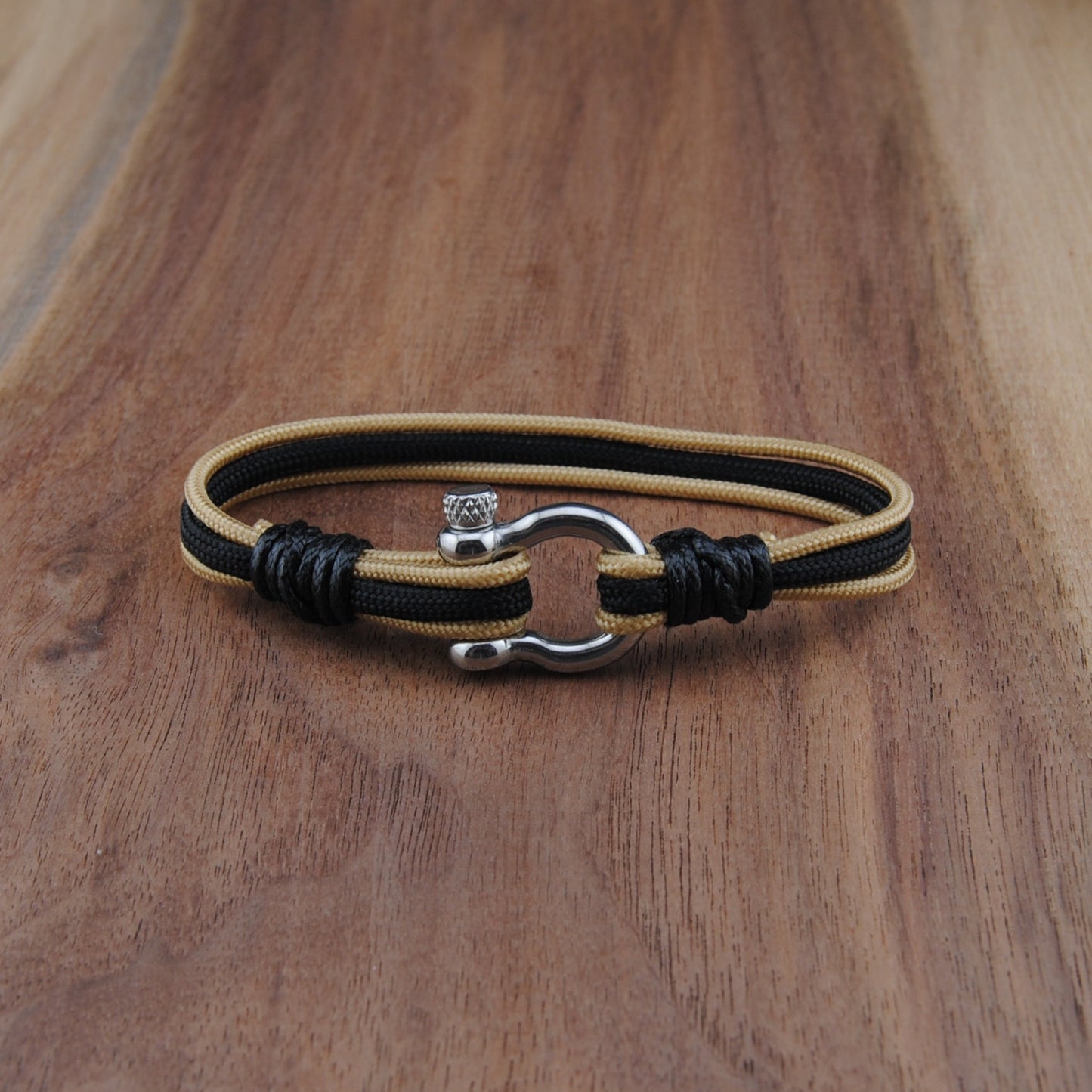 Bracelet with a clasp on a wooden surface