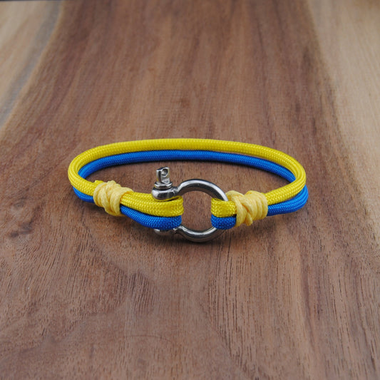 Yellow and blue bracelet on a wooden surface