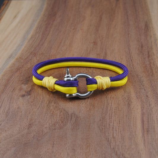 Yellow and purple bracelet on a wooden surface
