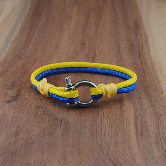 Yellow and blue bracelet on a wooden surface