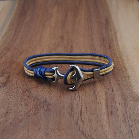 Bracelet with anchor clasp on a wooden surface
