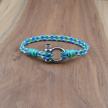 Bracelet with a metal clasp on a wooden surface