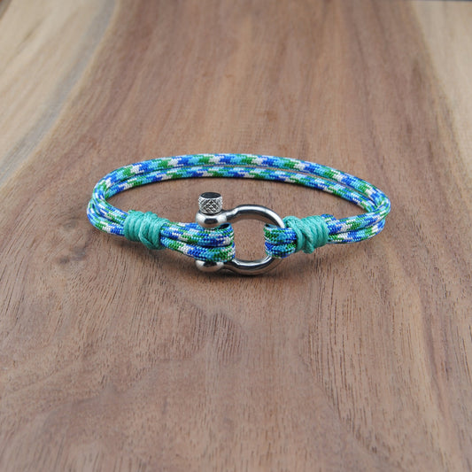 Bracelet with a metal clasp on a wooden surface