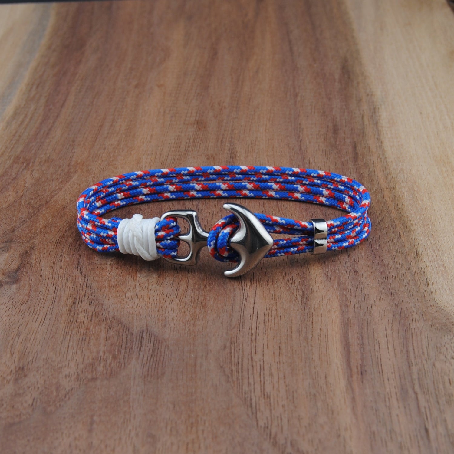 Bracelet with anchor clasp on a wooden surface