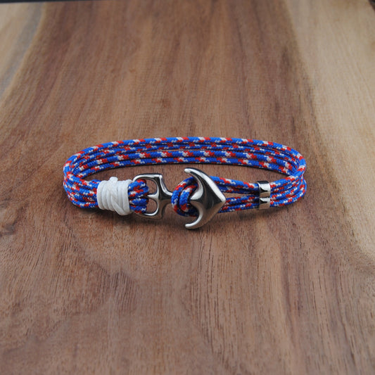 Bracelet with anchor clasp on a wooden surface