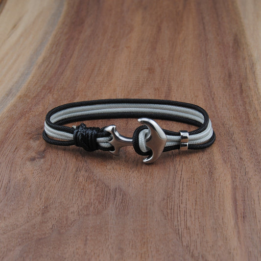 Bracelet with a metal clasp on a wooden surface