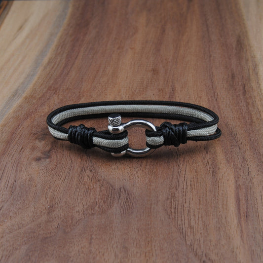 Bracelet with a silver clasp on a wooden surface