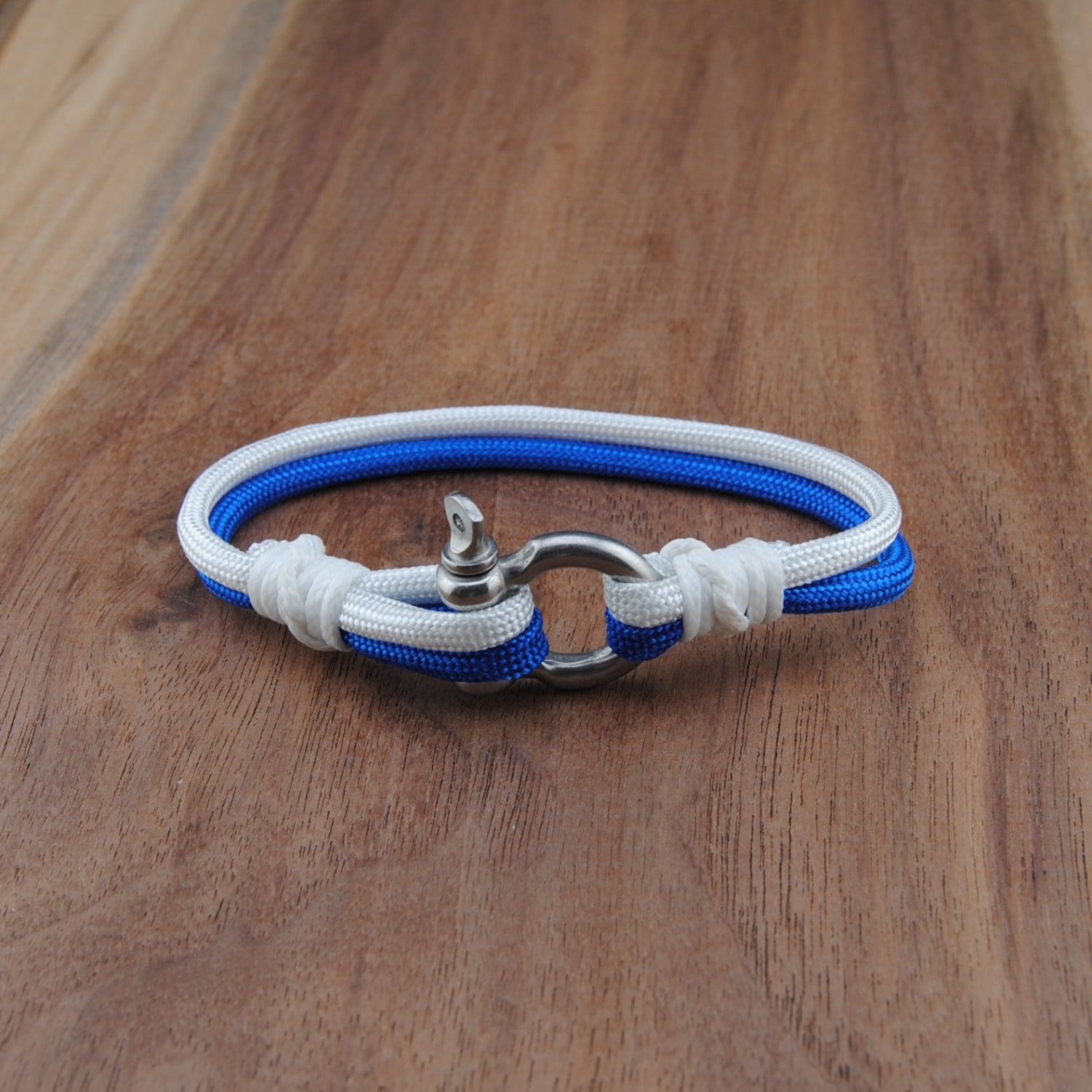 Blue and white bracelet on a wooden surface