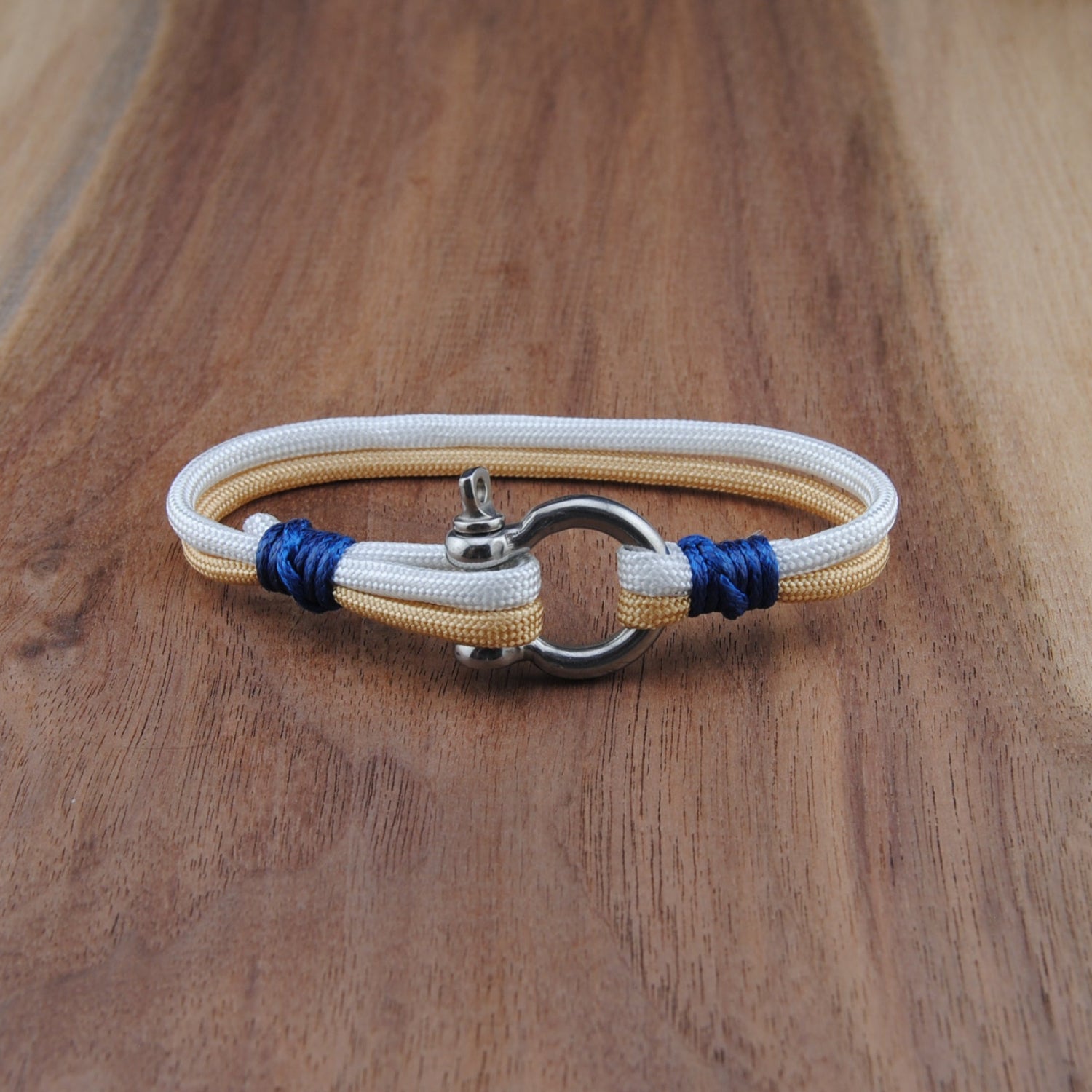 Bracelet with blue accents on a wooden surface