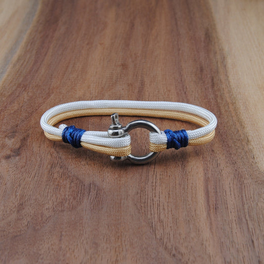 Bracelet with blue accents on a wooden surface