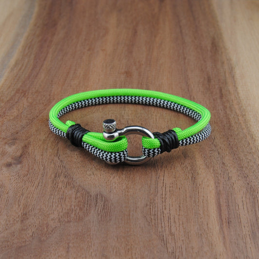 Neon green and black bracelet on a wooden surface